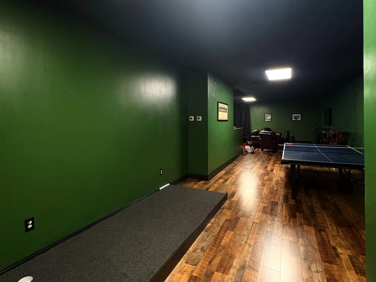 Dedicated putting area inside Legacy Golf Lounge